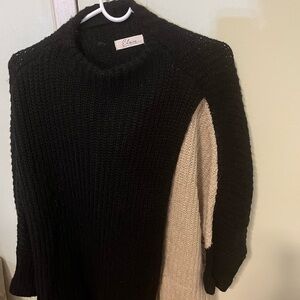 Elan Two-Tone Black and Cream Sweater. Side opens